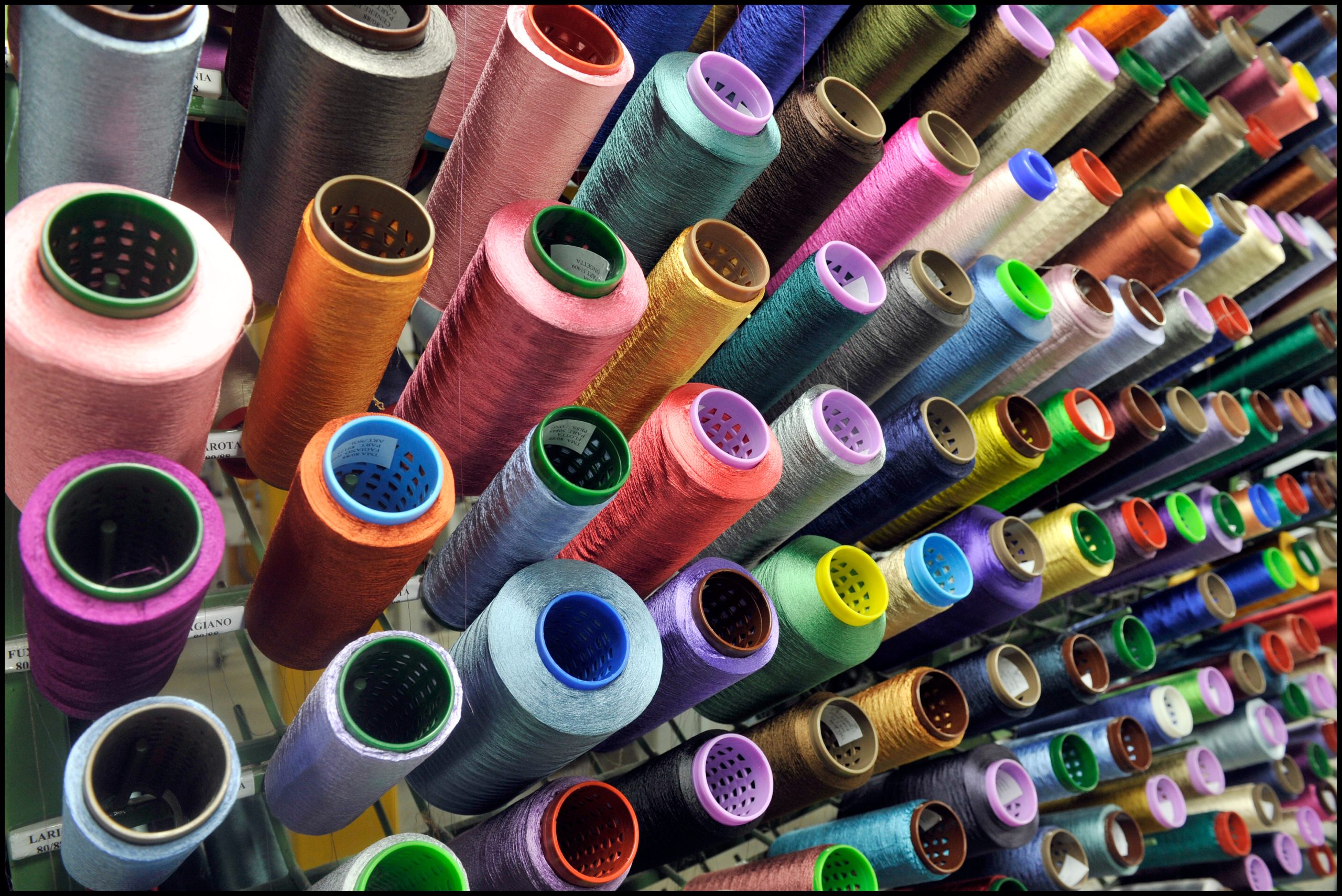 Textile industry with knitting machines in factory – italian – made in Italy Textile industry with knitting machines in factory – italian – made in Italy